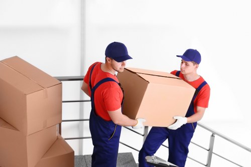 Packed moving boxes and furniture in a Kingston removal van