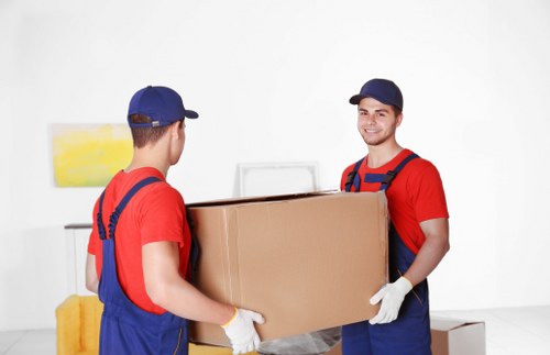 Professional house removalists in Kingston loading furniture into a moving truck