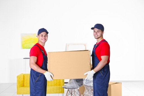Professional furniture removals in Kingston with moving truck and wrapped items