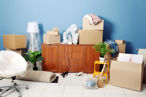 Commercial movers loading office furniture for a Kingston business relocation