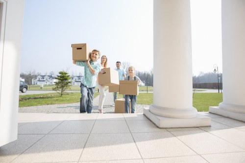 Loading furniture into a van for a Kingston removal job