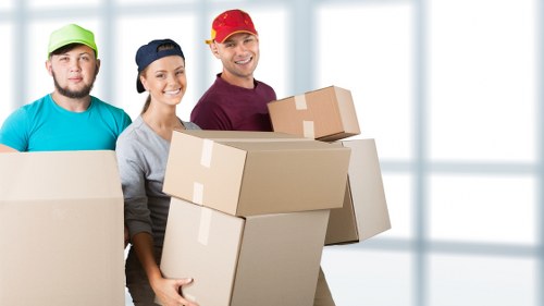 Same day removals team loading furniture in Kingston
