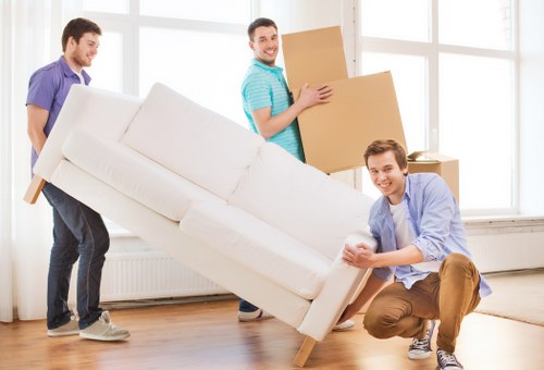 Packing boxes and preparing belongings for house removals in Kingston