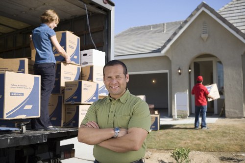 Kingston man with a van sorting recyclable household items