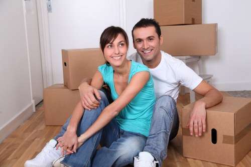 Local movers handling sofas and tables for furniture removals in Kingston