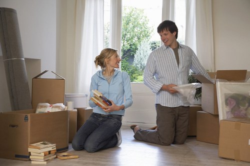 Organized storage unit in Kingston with boxes and furniture
