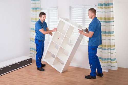 Loading household furniture into a removal truck in Kingston