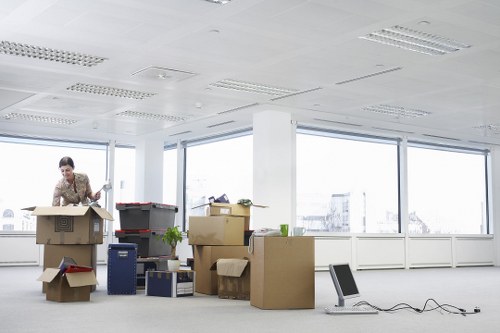 Office furniture removals in Kingston with desks and cabinets being moved