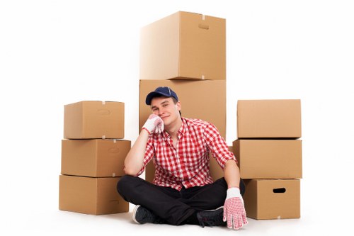 Loading boxes into a moving truck in Kingston with care