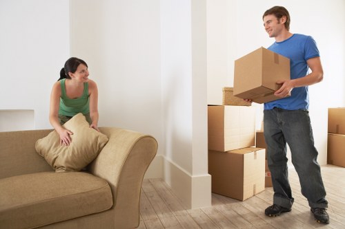 Loading furniture into a van for a Kingston move
